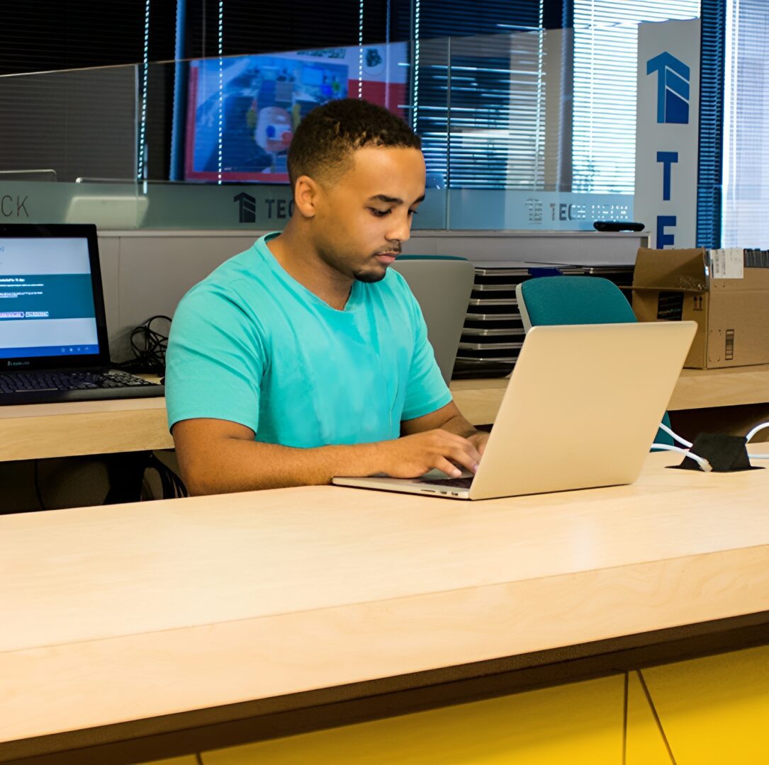 Office worker using a silver laptop